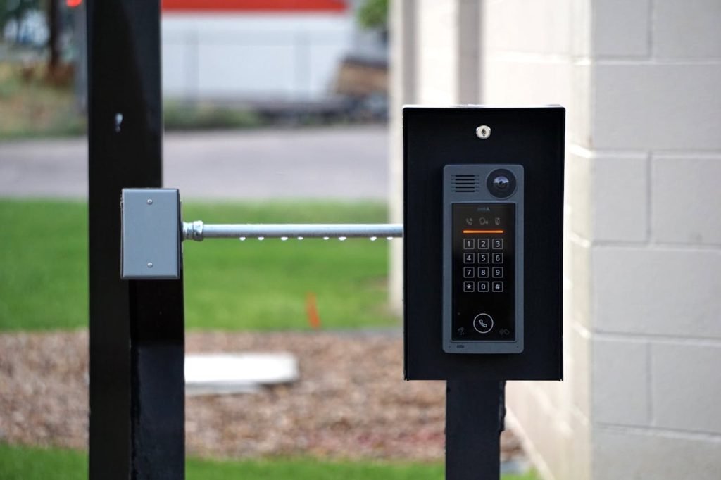 Access Control - Outdoor intercom mounted at a residential building entrance, ensuring security and communication.